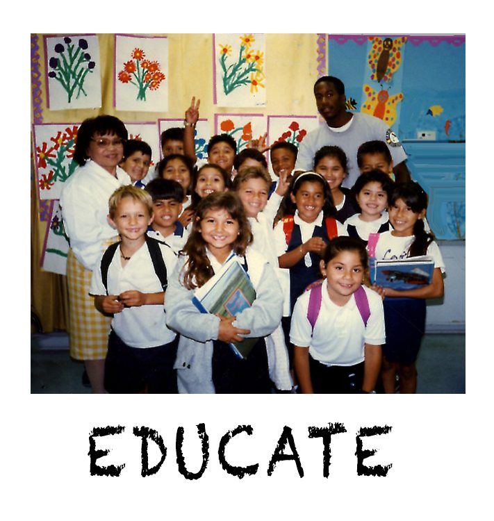 A group of children in school uniforms posing for the camera.